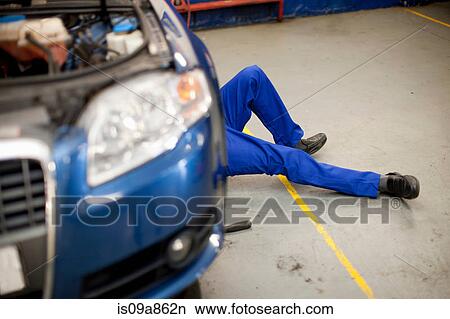 Picture - Car mechanic at work in service bay. Fotosearch