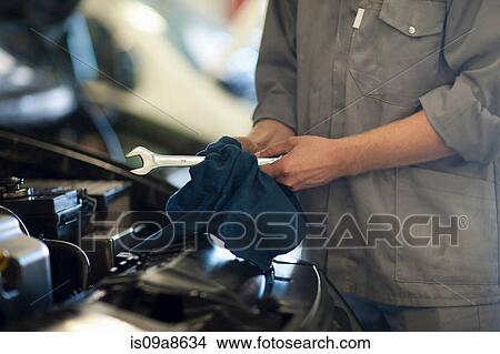 Car mechanic on completion of job View Large Photo Image Picture - Car mechanic on completion of job. Fotosearch