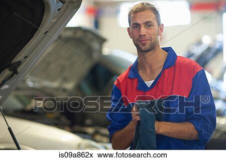 Car mechanic on completion of job View Large Photo Image Stock Photo - Car mechanic on completion of job. Fotosearch