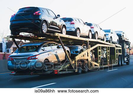 Cars transported on truck on highway View Large Photo Image Stock Image - Cars transported on truck on highway. Fotosearch