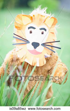 Stock Photo - Child wearing lion costume. Fotosearch