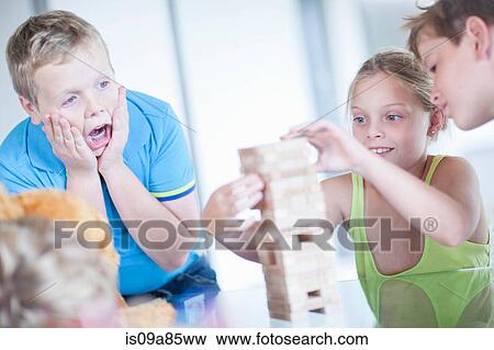 Stock Photo - Children playing wood blocks. Fotosearch