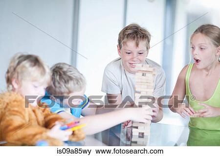 Children playing wood blocks View Large Photo Image Stock Photo - Children playing wood blocks. Fotosearch
