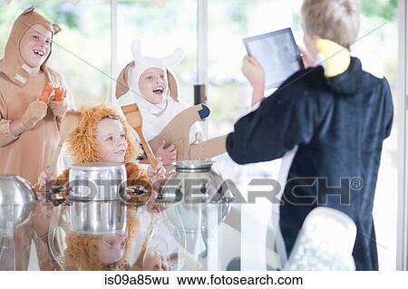 Children pretending to play music instruments View Large Photo Image Stock Photograph - Children pretending to play music instruments. Fotosearch