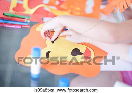 Stock Image - Children's mask making party. Fotosearch