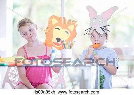 Stock Image - Children's mask making party. Fotosearch