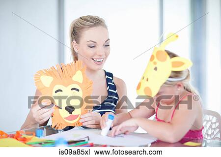 Stock Image - Children's mask making party. Fotosearch