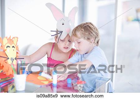 Stock Photo - Children's mask making party. Fotosearch