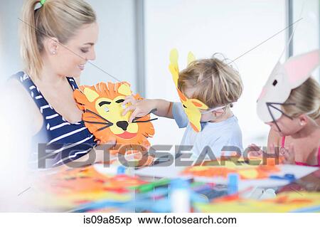 Stock Photography - Children's mask making party. Fotosearch