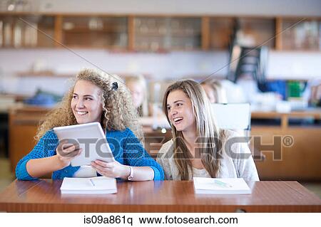 Stock Photography - Classmates enjoying lesson. Fotosearch