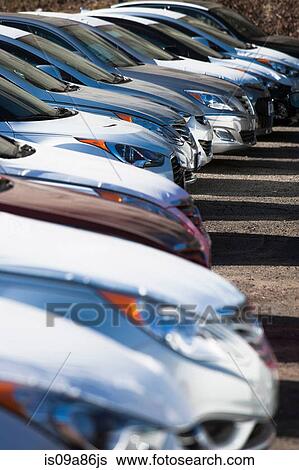 Stock Photograph - Close up of cars in parking lot. Fotosearch