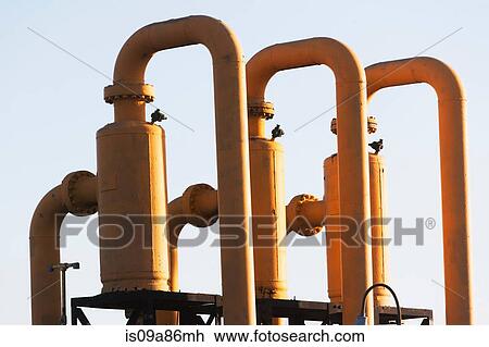 Stock Image - Close up of industrial pipes. Fotosearch