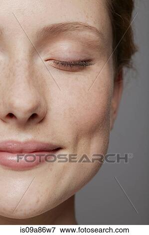 Close up of part of young woman's face with eyes closed View Large Photo Image Stock Photo - Close up of part of young woman's face with eyes closed. Fotosearch