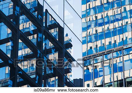 Stock Photo - Close up of skyscrapers with glass facades. Fotosearch