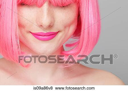 Stock Photo - Close up of teenage girl with pink hair. Fotosearch