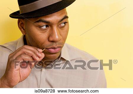 Close up portrait of mid adult male wearing hat View Large Photo Image Stock Photo - Close up portrait of mid adult male wearing hat. Fotosearch