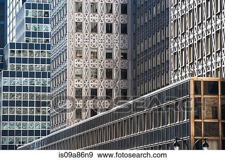 Close up side view of office buildings View Large Photo Image Stock Photo - Close up side view of office buildings. Fotosearch