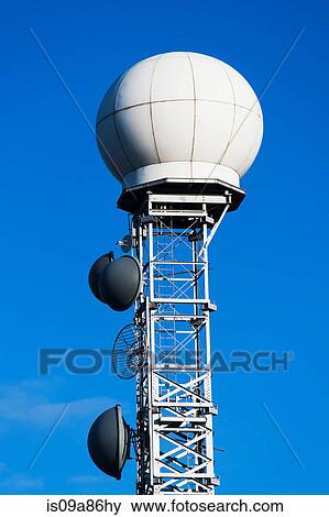 Stock Photo - Communications tower against blue sky. Fotosearch