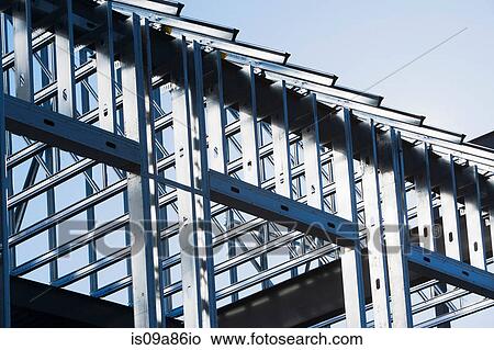 Construction frame of steel girders on construction site View Large Photo Image Picture - Construction frame of steel girders on construction site. Fotosearch