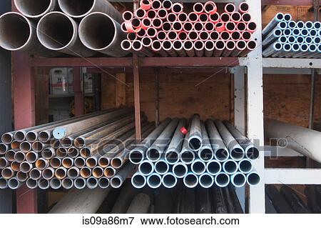 Construction piping on shelves View Large Photo Image Stock Photo - Construction piping on shelves. Fotosearch