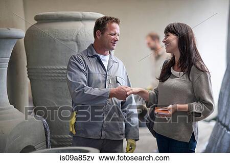 Dealing with sales in pottery factory View Large Photo Image Stock Photo - Dealing with sales in pottery factory. Fotosearch