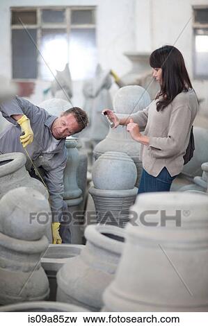Dealing with sales in pottery factory View Large Photo Image Stock Photo - Dealing with sales in pottery factory. Fotosearch