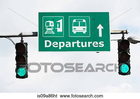 Stock Photograph - Departure sign with green traffic lights. Fotosearch