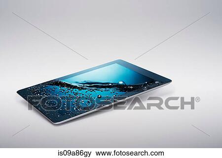 Digital tablet with gently rising bubbling water on screen View Large Photo Image Stock Photo - Digital tablet with gently rising bubbling water on screen. Fotosearch