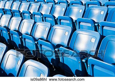 Empty blue seating in sports stadium View Large Photo Image Stock Image - Empty blue seating in sports stadium. Fotosearch