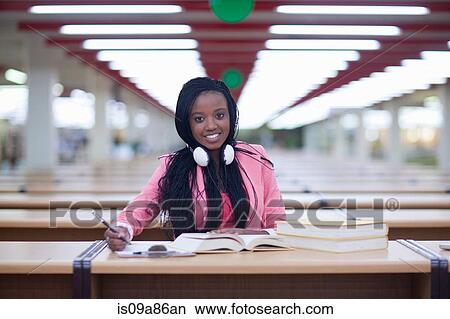 Female student studying in library View Large Photo Image Picture - Female student studying in library. Fotosearch