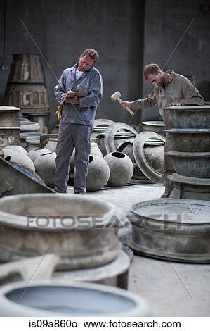 Fetching potters wheel at pottery factory View Large Photo Image Picture - Fetching potters wheel at pottery factory. Fotosearch