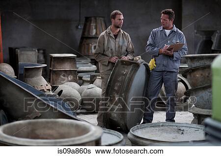 Fetching potters wheel at pottery factory View Large Photo Image Stock Photograph - Fetching potters wheel at pottery factory. Fotosearch