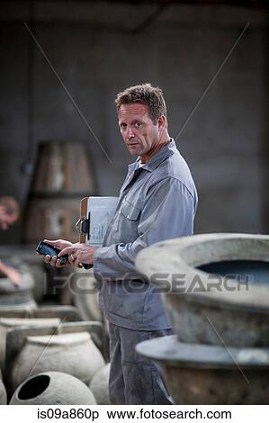 Fetching potters wheel at pottery factory View Large Photo Image Stock Photography - Fetching potters wheel at pottery factory. Fotosearch