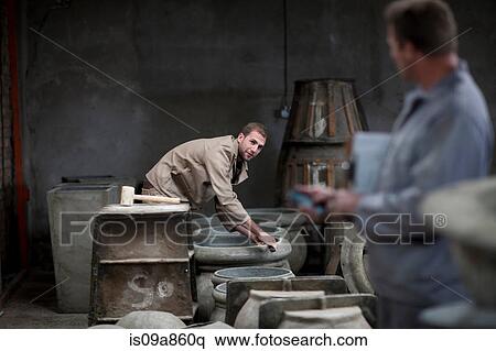 Fetching potters wheel at pottery factory View Large Photo Image Stock Photography - Fetching potters wheel at pottery factory. Fotosearch