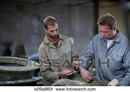 Stock Photography - Fetching potters wheel at pottery factory. Fotosearch
