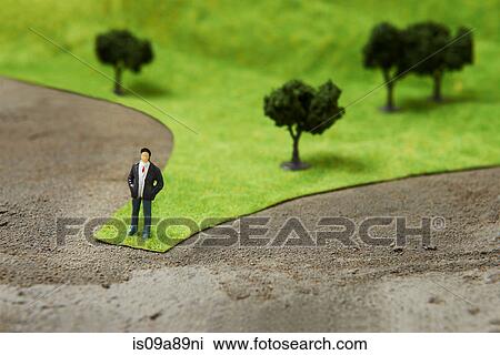Figurine on pretend grass with trees View Large Photo Image Stock Image - Figurine on pretend grass with trees. Fotosearch