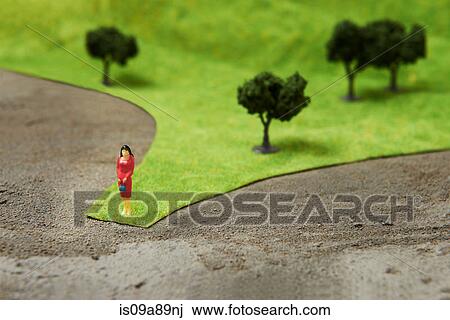 Figurine on pretend grass with trees View Large Photo Image Stock Image - Figurine on pretend grass with trees. Fotosearch