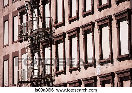 Fire escape on brown building View Large Photo Image Stock Photograph - Fire escape on brown building. Fotosearch