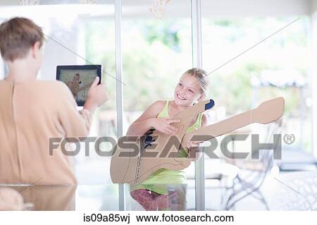 Girl playing the guitar View Large Photo Image Stock Image - Girl playing the guitar. Fotosearch