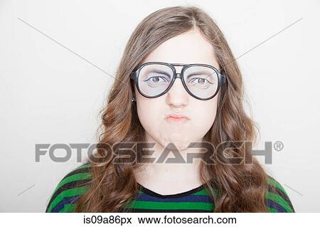 Stock Photo - Girl wearing fake glasses. Fotosearch