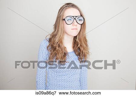 Girl wearing fake glasses View Large Photo Image Stock Photo - Girl wearing fake glasses. Fotosearch