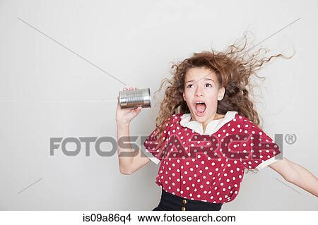 Girl with tin can telephone, mouth open View Large Photo Image Picture - Girl with tin can telephone, mouth open. Fotosearch