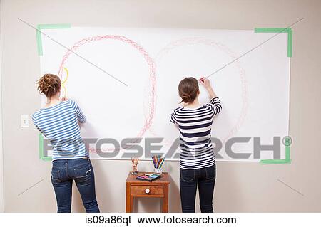 Girls drawing on wall View Large Photo Image Stock Photograph - Girls drawing on wall. Fotosearch
