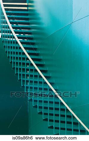 Stock Photograph - Green staircase on storage tank. Fotosearch