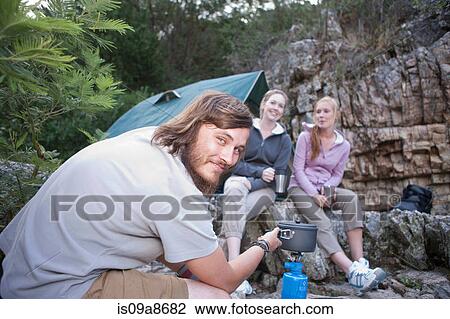 Group of young people camping View Large Photo Image Stock Image - Group of young people camping. Fotosearch