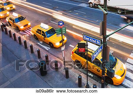 High angled view of yellow cabs in a row at pedestrian crossing New York City, USA View Large Photo Image Stock Photography - High angled view of yellow cabs in a row at pedestrian crossing New York City, USA. Fotosearch