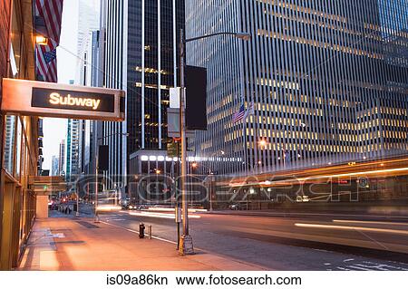 Illuminated subway sign at dusk, New York City, USA View Large Photo Image Picture - Illuminated subway sign at dusk, New York City, USA. Fotosearch