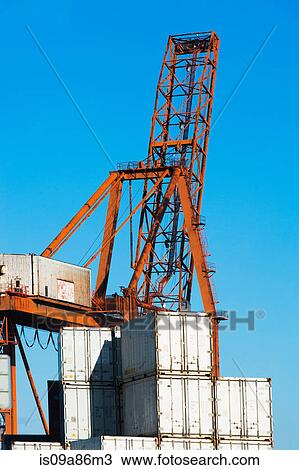 Stock Image - Loading crane and containers. Fotosearch