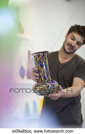 Man holding glass vase View Large Photo Image Stock Photography - Man holding glass vase. Fotosearch