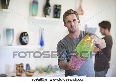 Man holding glass vase View Large Photo Image Stock Photography - Man holding glass vase. Fotosearch